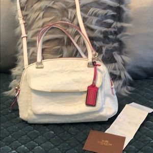 Coach purse white with pink trim.